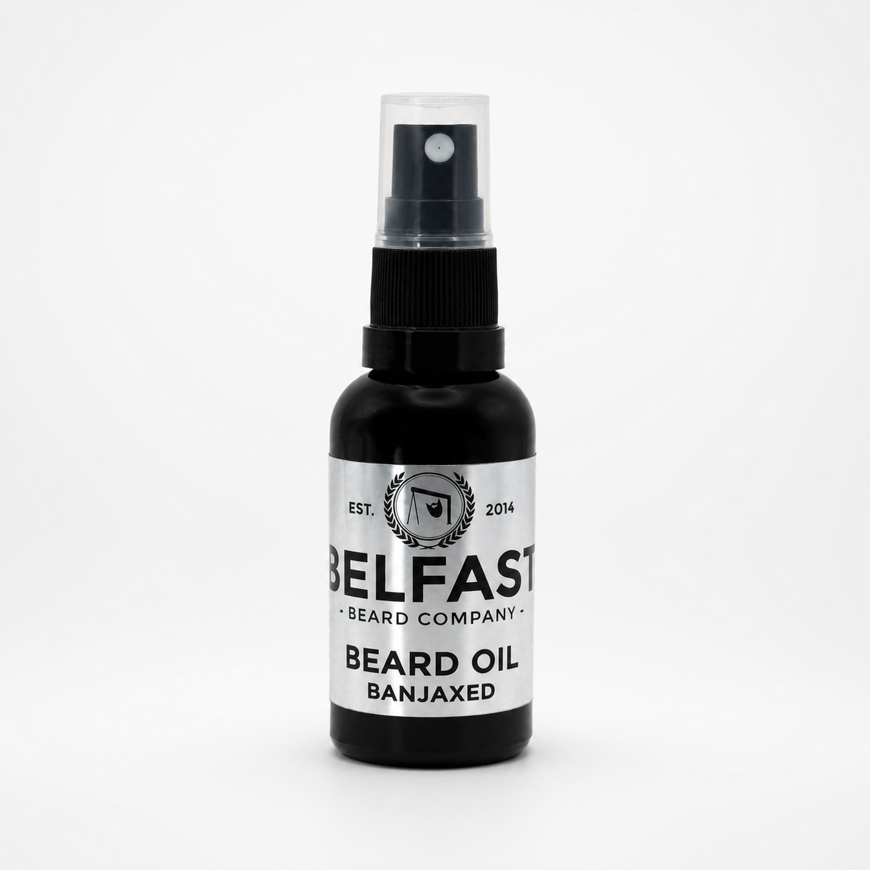 A bottle of Belfast Beard Company Beard Oil in the 'Banjaxed' scent, featuring a black bottle and a white label with black text, set against a plain white background.