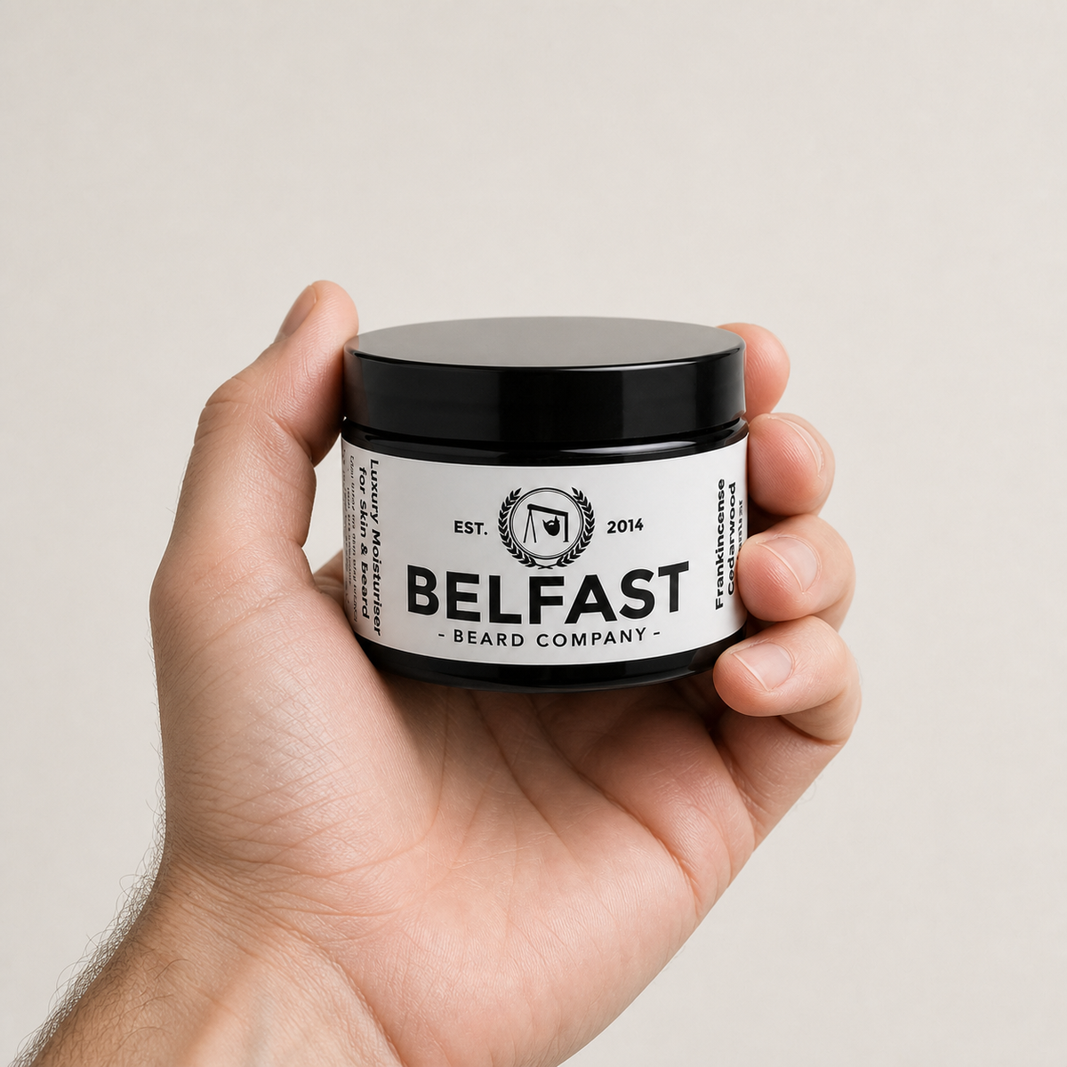 Luxury Moisturiser 50ml held in a hand to show its size