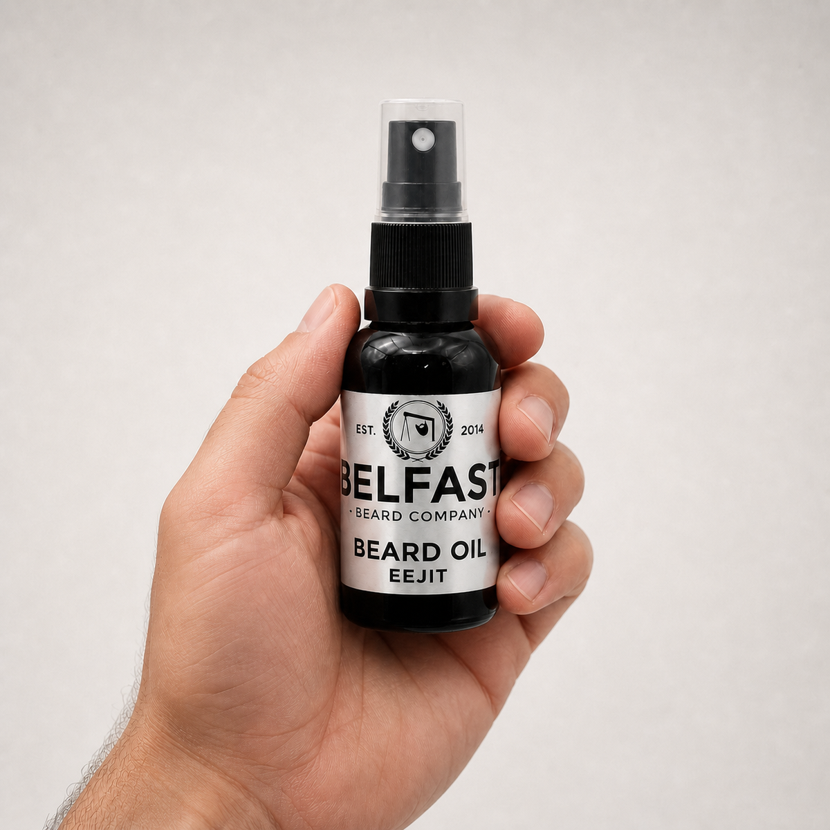 Eejit Beard Oil 30ml held in a hand to show its size
