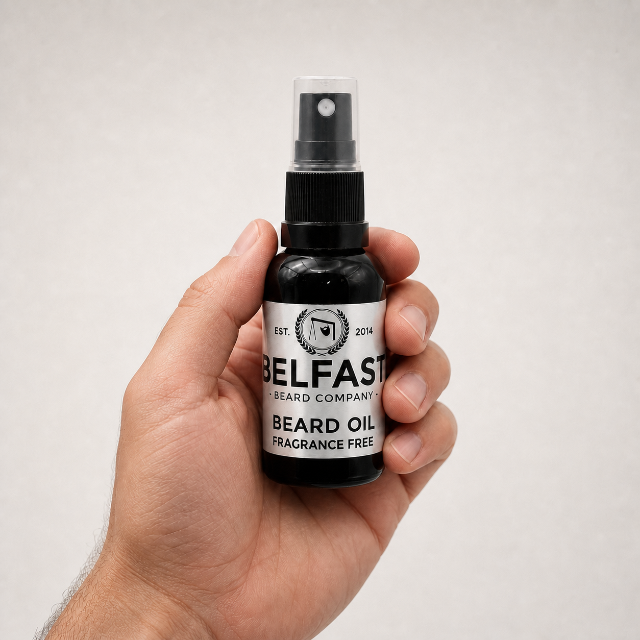 Fragrance-Free Beard Oil 30ml held in a hand to show its size