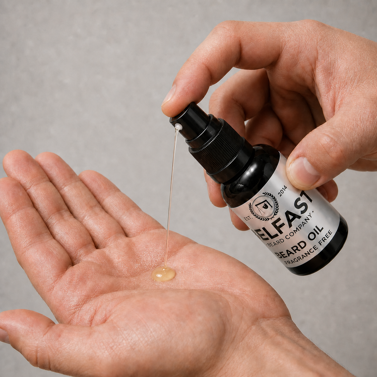 Hand dispensing Fragrance-Free Beard Oil 30ml from the atomiser into an open palm