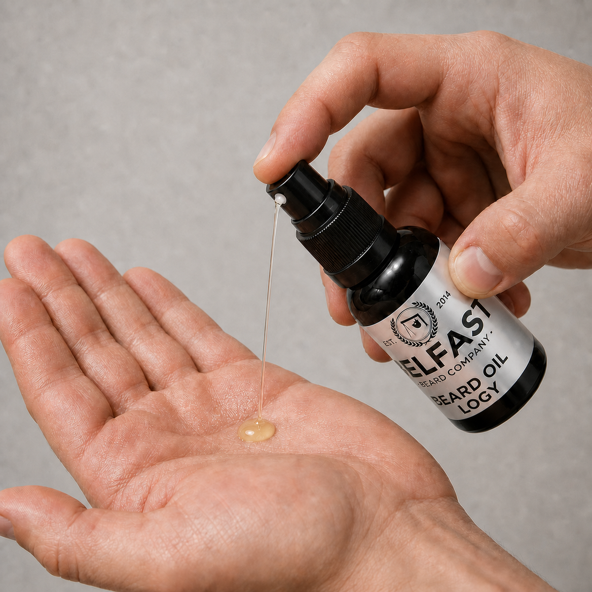 Hand dispensing Logy Beard Oil 30ml from the atomiser into an open palm