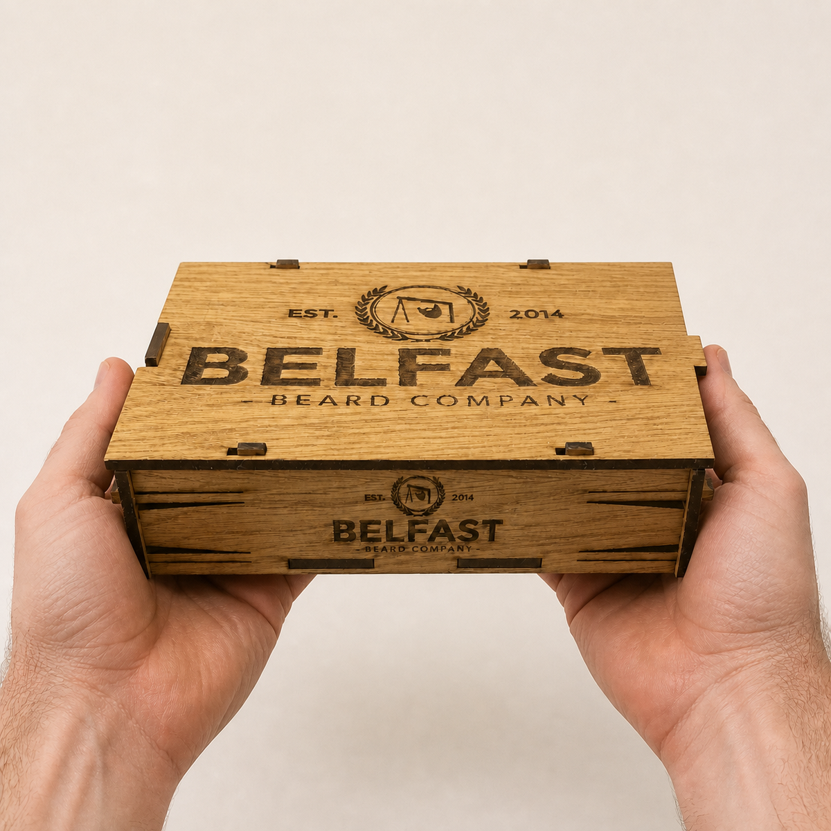 The Cache Box Set held in a hand to show its size